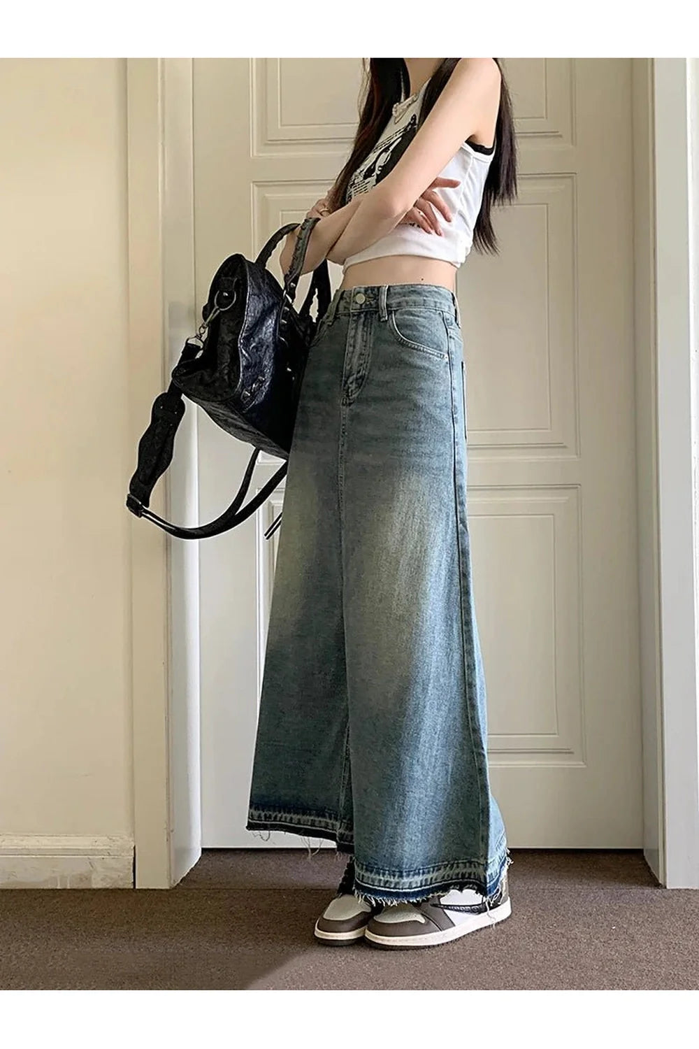 Vintage long denim skirt in classic blue shade.