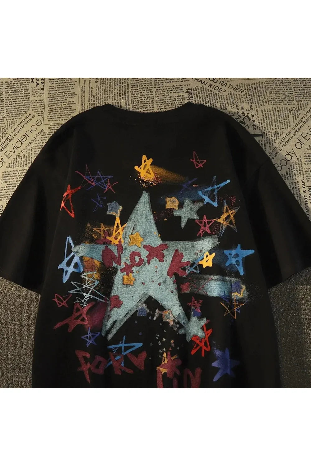 Abstract Star Sketch T-Shirt in black, artistic design.