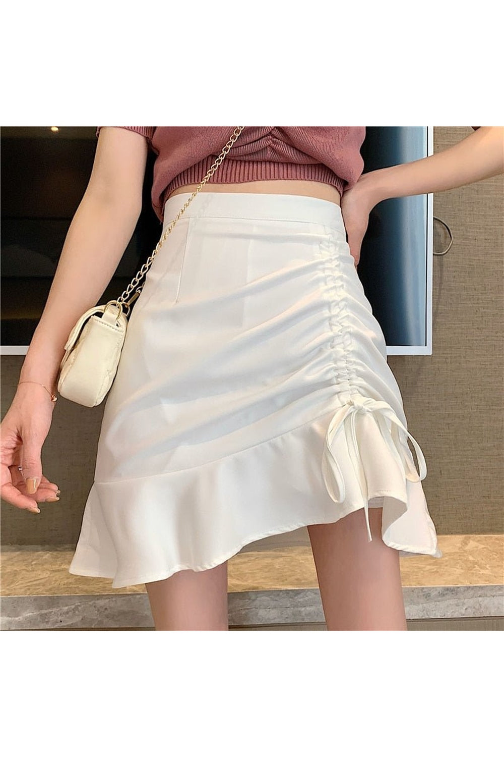 White Aesthetic Irregular Pleated Skirt with unique design.