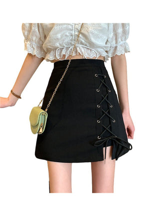 Stylish black lace-up mini skirt enhances outfit.