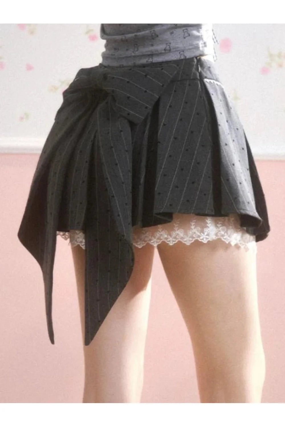 Stylish Asymmetrical Bow Print Skirt with bow detail.