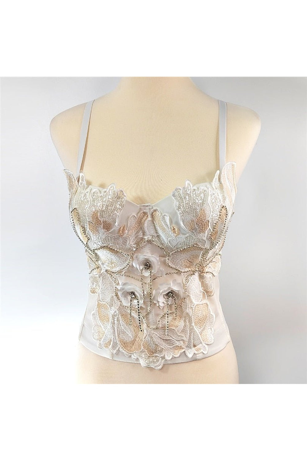 Elegant white camisole with intricate beading detail.