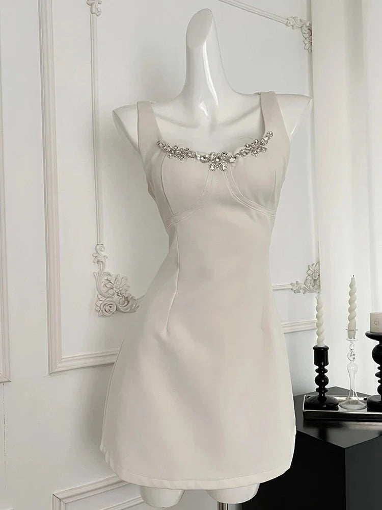 Elegant White A-Line Dress with Crystal Trim.