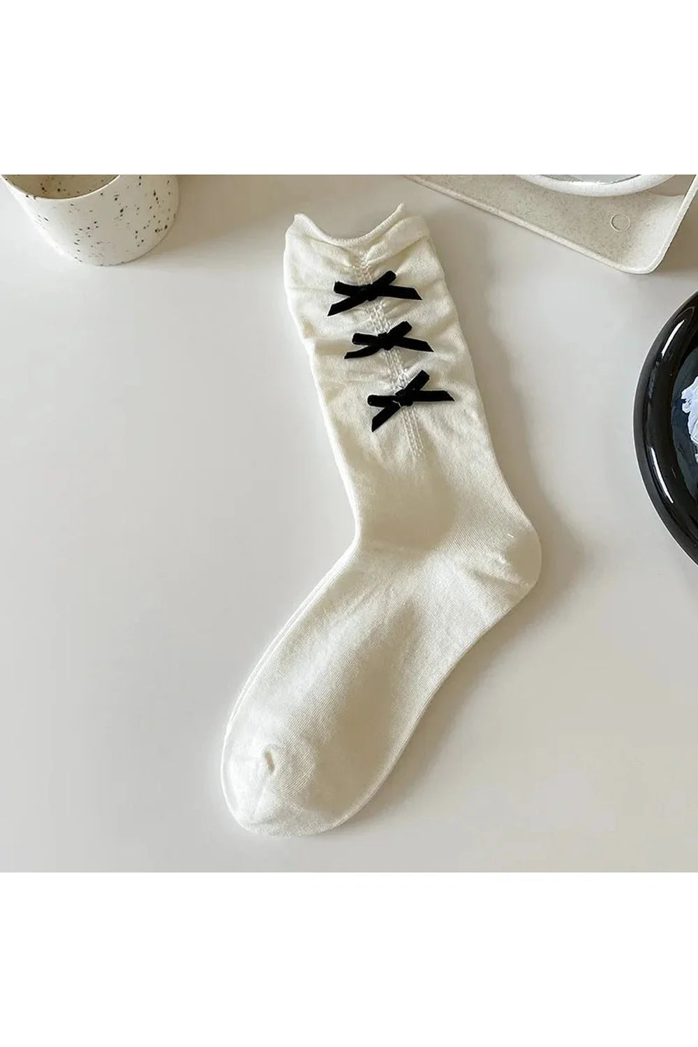 Cute ankle socks with black bows.