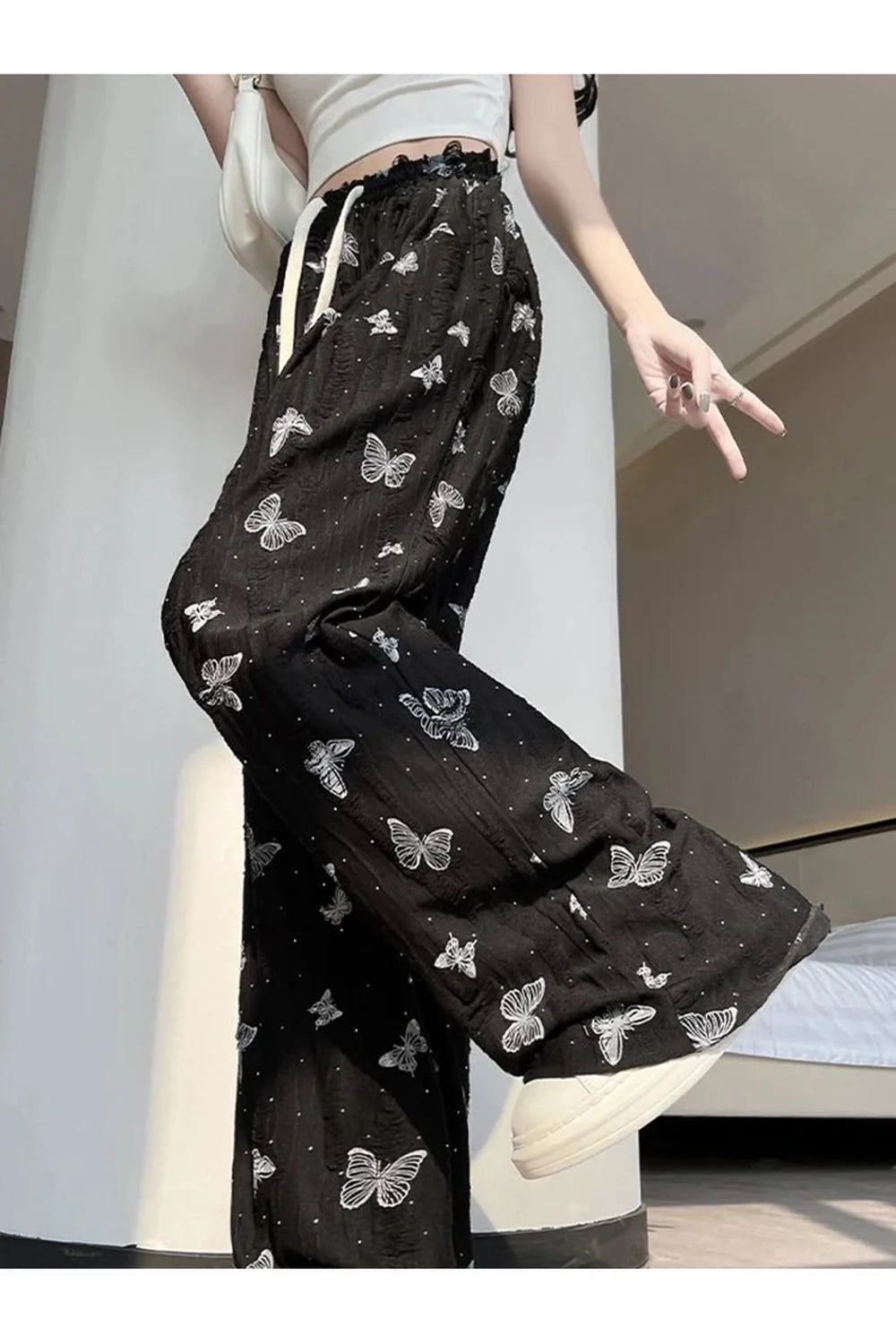 Black Butterfly Embroidered Wide-Leg Pants featuring elegance.