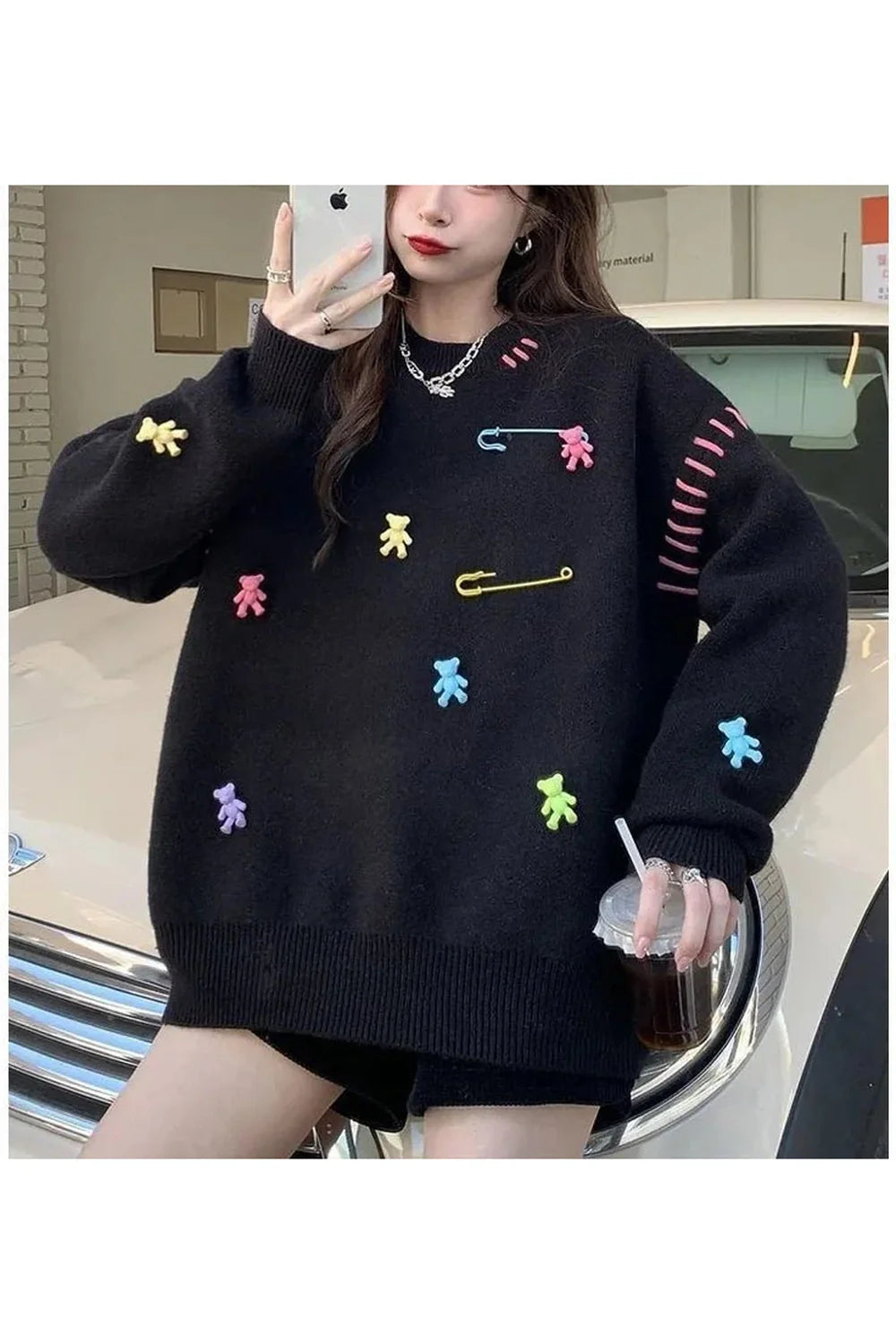 Cozy black knit sweater for Fall Candyland charm.