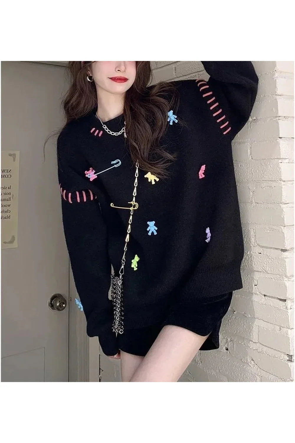 Cozy black knit sweater for Fall Candyland charm.