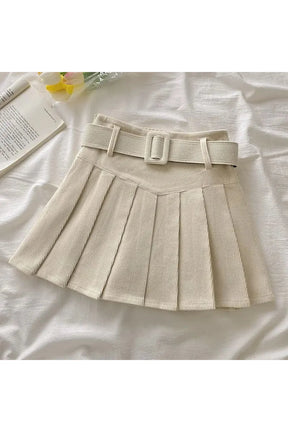 Apricot pleated skirt with charming belt detail.