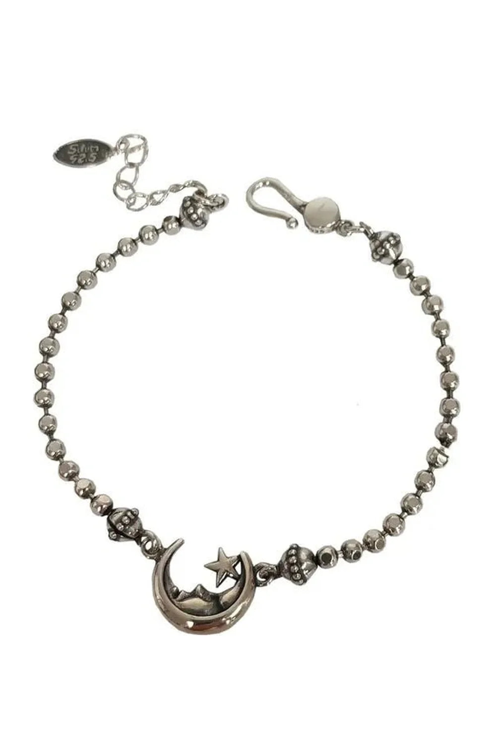 Shiny silver plated celestial moon & star bracelet.