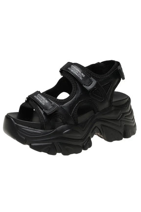 Chunky black platform sandals, trendy and chic.