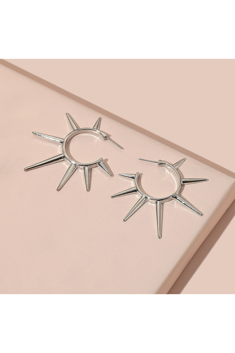 Silver cone rivet hoop earrings for stylish looks.