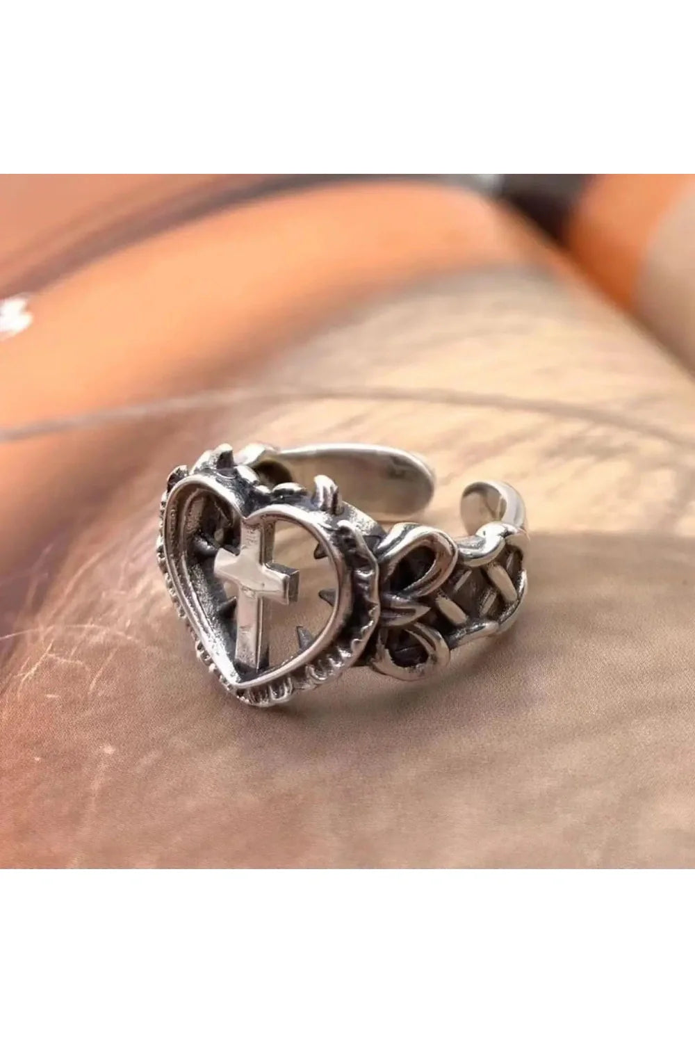 Silver Death Cross Heart Ring shimmering elegantly.