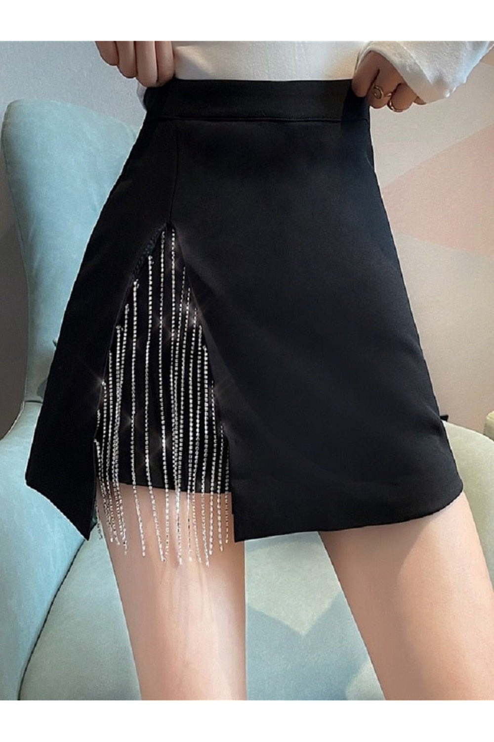 Black Diamond Chain Mini Skirt shimmers elegantly.