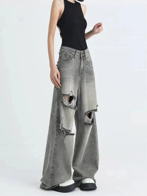 Grey distressed oversized baggy jeans, casual style.