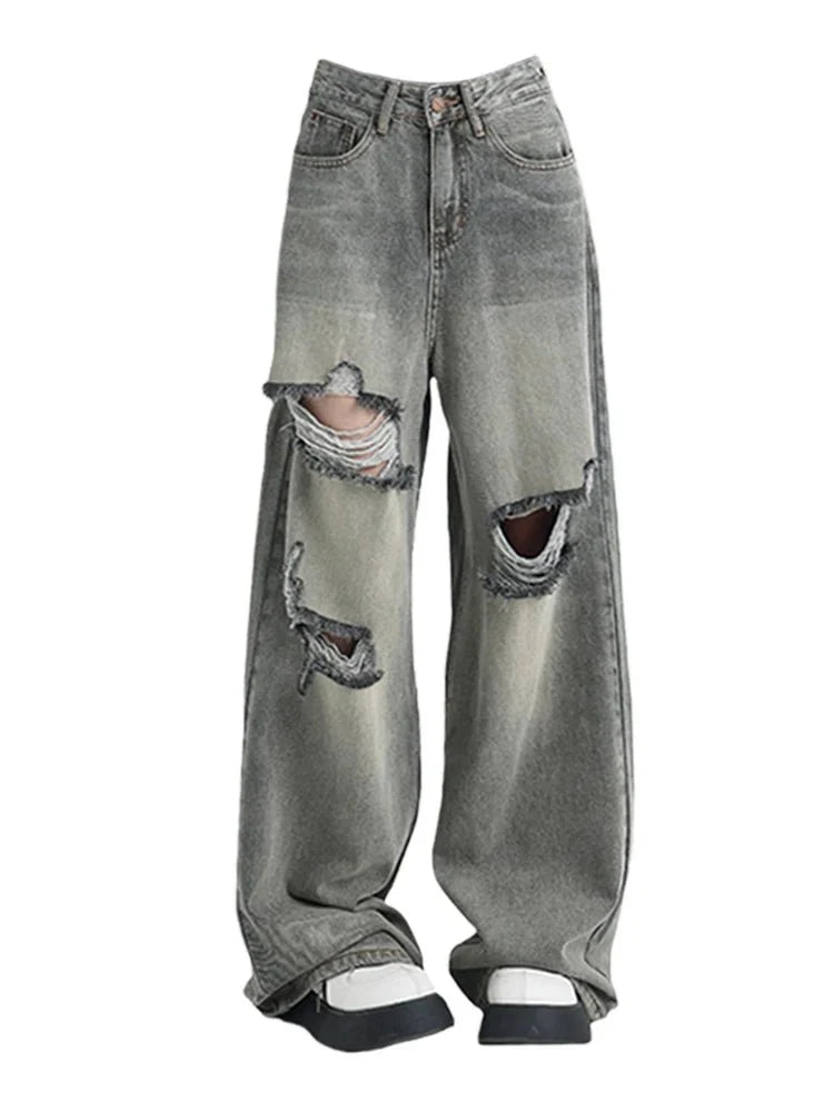 Grey distressed oversized baggy jeans, casual style.