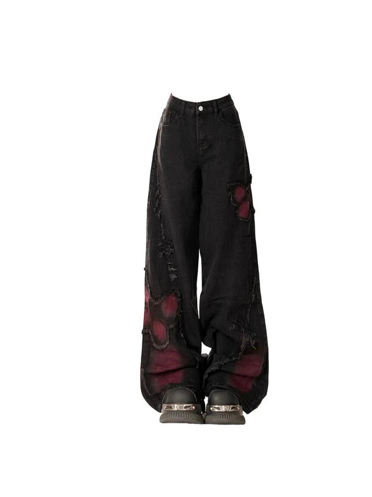 Distressed Red Butterfly Denim Pants in Black shimmer.