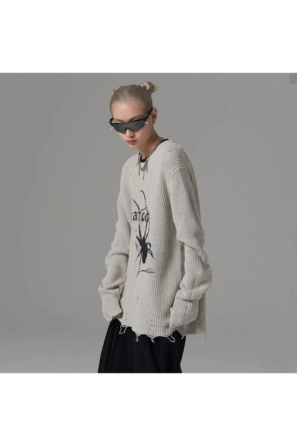 Gray Distressed Spider Graphic Sweater showcases unique design.