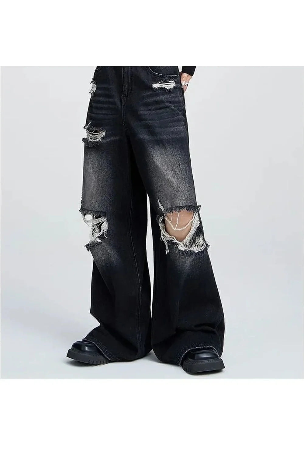 Distressed black wide-leg jeans for fall style.