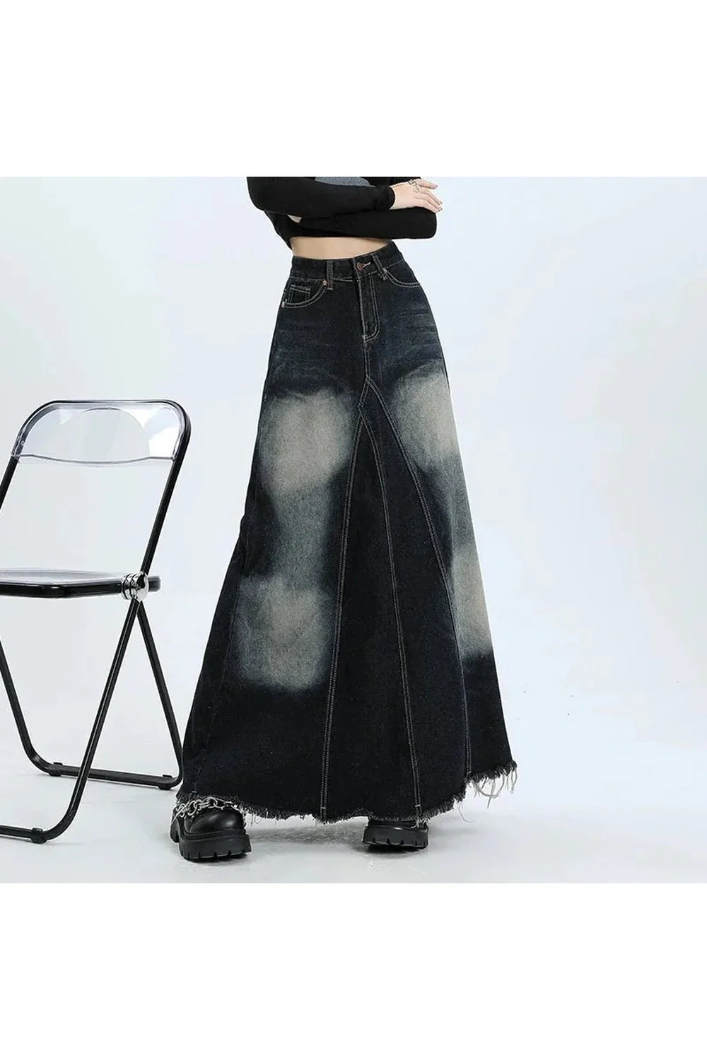 Long black denim skirt with faded effect.