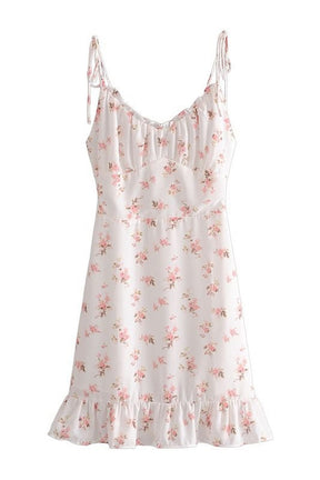 White floral print spaghetti dress, perfect for summer.