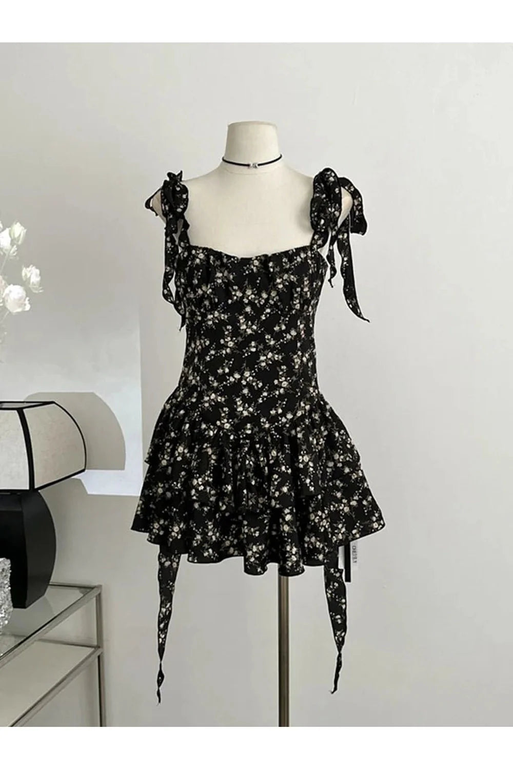 Black Floral Ruffle Tie-Strap Dress with elegance.