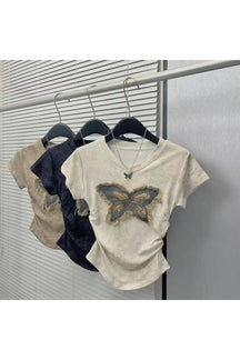 White butterfly patch top with frayed edges.