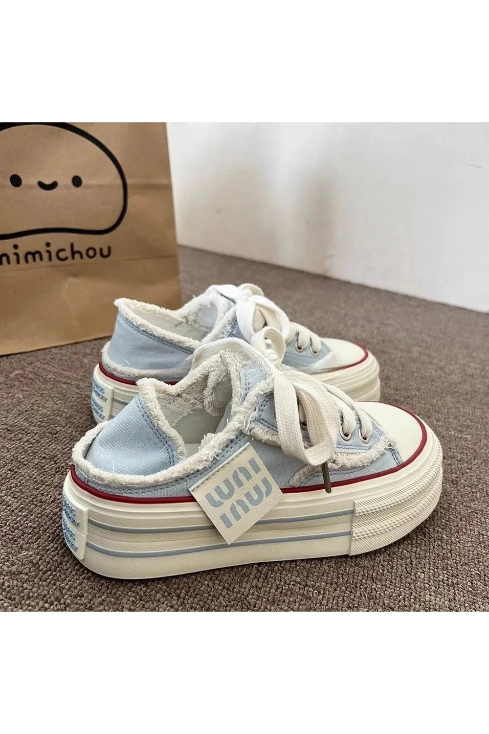 Blue Frayed Canvas Platform Sneakers in SKY BLUE.