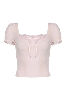 Pink Frill Lace Bow Top with delicate details.