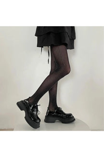 Shimmer in style with Black striped tights.