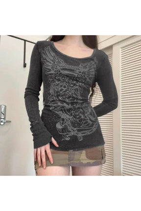 Long sleeve top featuring gothic angel graphic.