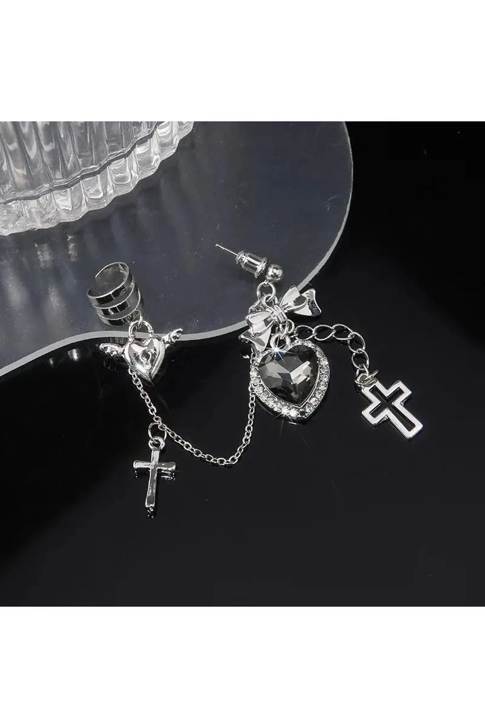 Single gothic cross chain ear clip in black.