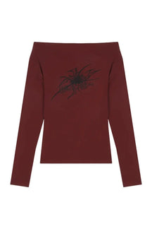 Off-shoulder crop top in burgundy, gothic style.