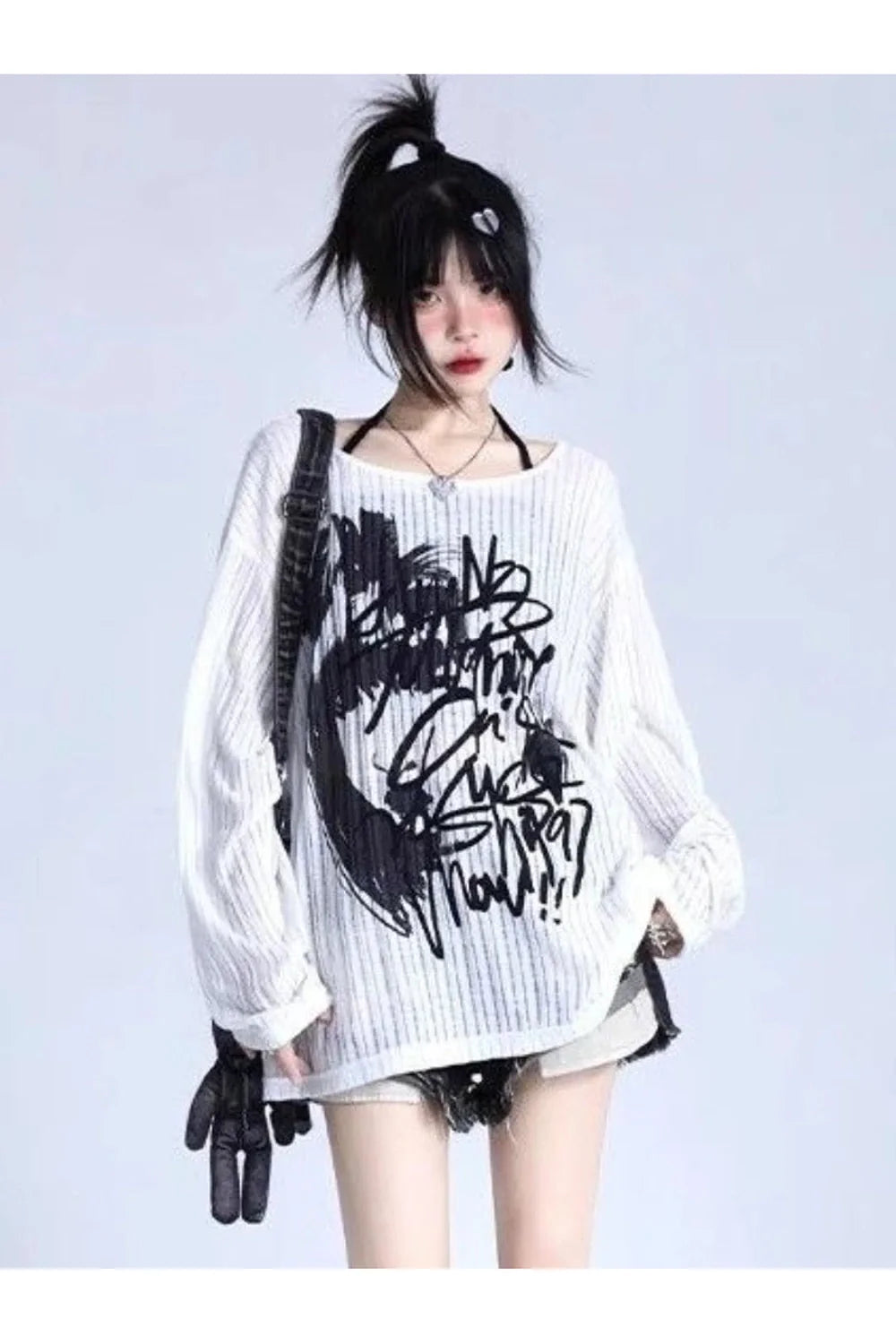 White oversized sweater with graffiti street style design.