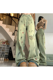 Yellow mud splattered wide-leg jeans for fall grunge.