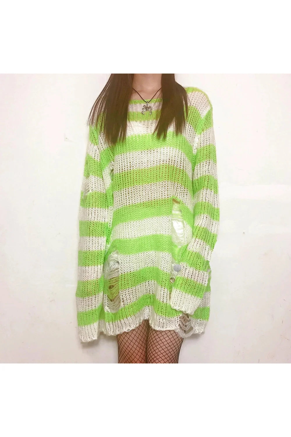 Light green Grunge Candy Striped Sweater exudes vintage charm.