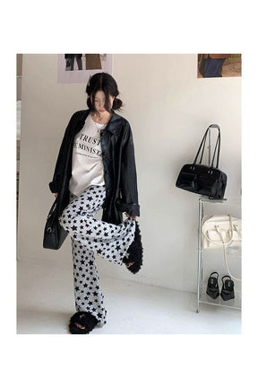 Black Grunge Star Print Flare Pants for women.