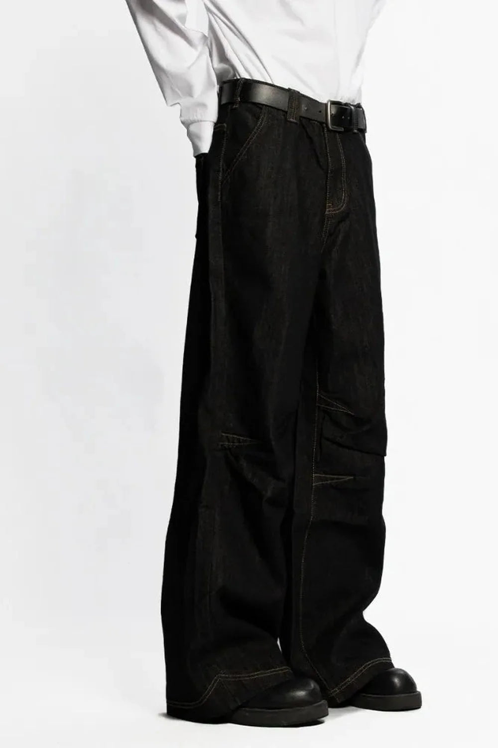 Vintage-inspired black cargo jeans with a grunge touch.