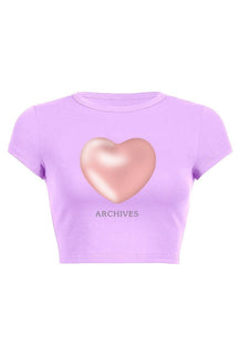 Baby crop top with heart print in purple.