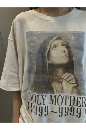 Graphic tee with Holy Mother design in white.