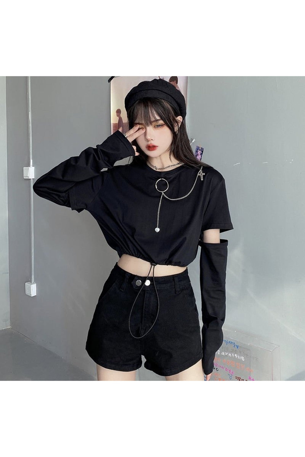 Stylish black Japanese T-shirt with chain accent.