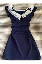 Blue lace-trimmed vintage doll dress for playtime elegance.