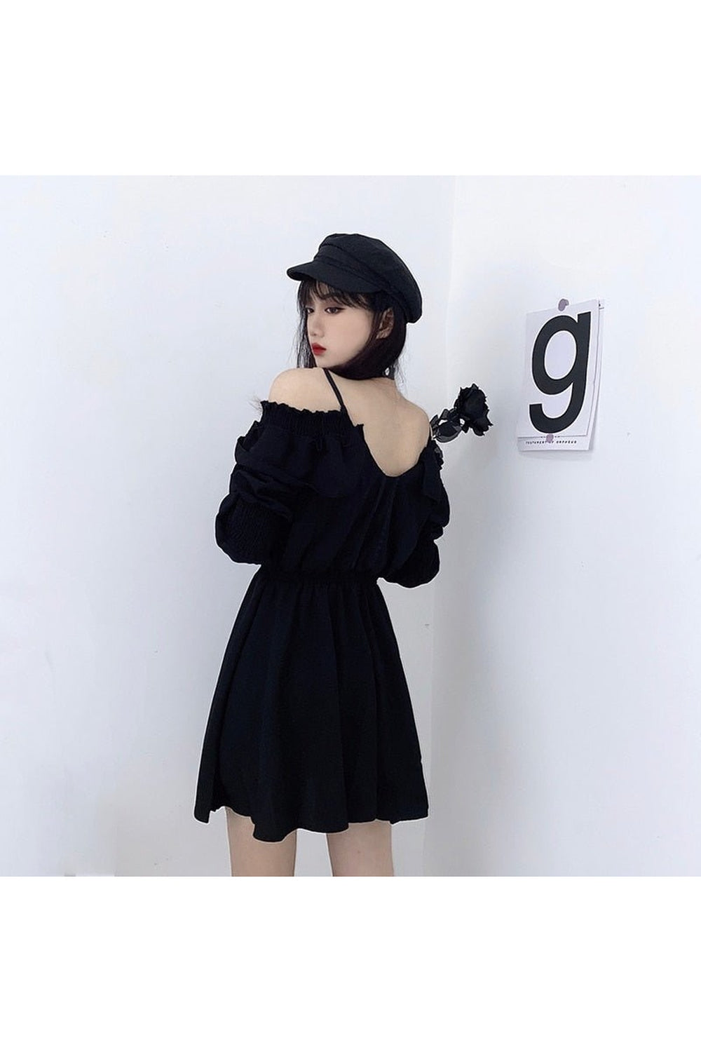 Black long sleeve gothic dress with elegance.