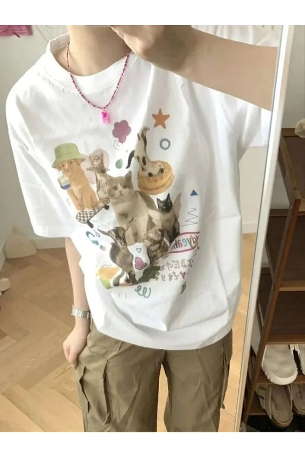 Oversized light grey t-shirt with milk cat graphic.