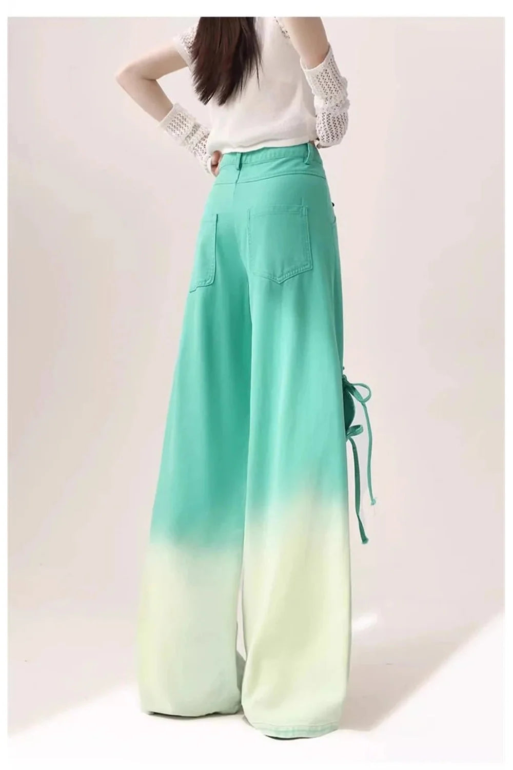 Blue ombre pants with cutout lace-up design.