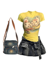 Grunge denim skirt, kitten top, crossbody handbag ensemble.