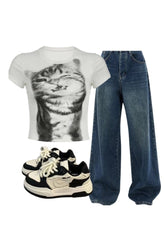 Y2k outfit featuring pixelated cat graphic, jeans, sneakers.