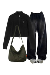 Trendy Y2K outfit: Zip-up sweater, grunge sweatpants.