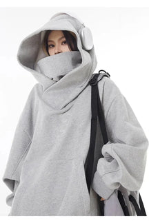 Gray oversized futuristic hooded sweatshirt, avant-garde style.