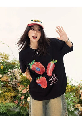 Oversized black graphic tee featuring strawberries.