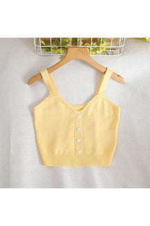 Yellow strap knit crop top, pastel colors.